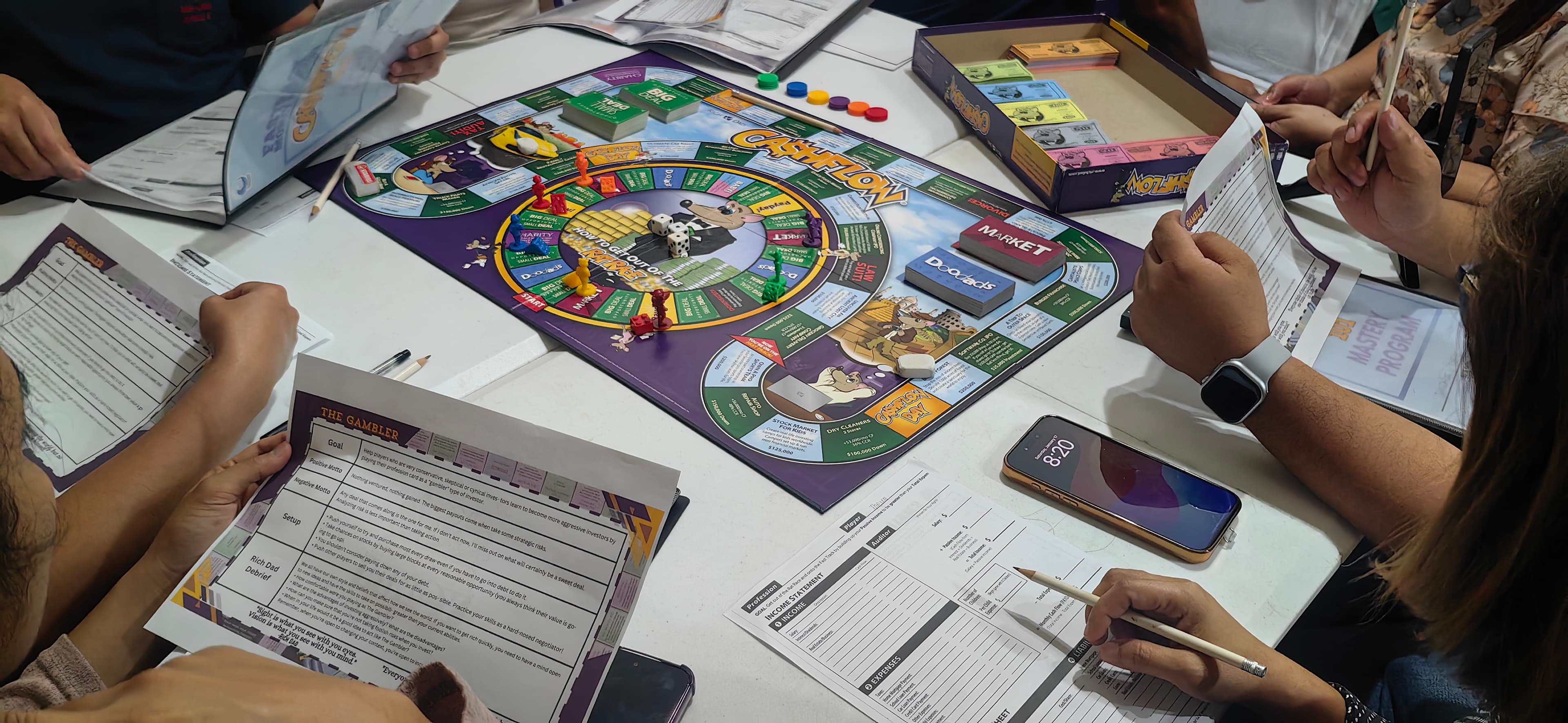 You sit down at the Cashflow 101 board and make real financial decisions — buying assets, handling emergencies, escaping the Rat Race — in a room where getting it wrong costs nothing.